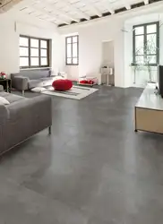 Gray porcelain tiles on the floor in the kitchen interior