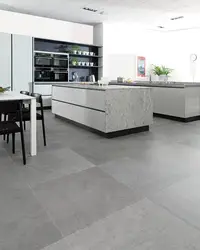 Gray porcelain tiles on the floor in the kitchen interior