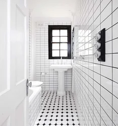 White bathtub with black grout photo