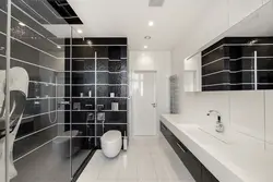 White bathtub with black grout photo