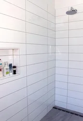 White Bathtub With Black Grout Photo