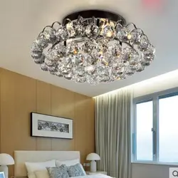 Ceiling chandelier in the living room with a low ceiling photo