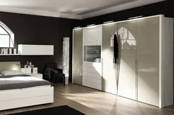 Glossy wardrobes in the bedroom photo