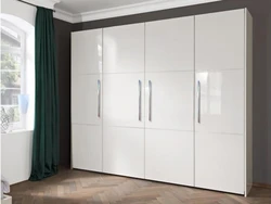 Glossy wardrobes in the bedroom photo