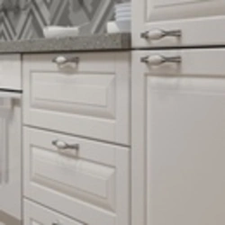 Handles on white kitchen facades photo