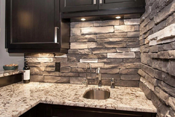 Photo of kitchen with stone panels