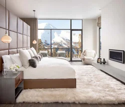 Bedroom design with panoramic windows in an apartment