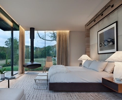 Bedroom design with panoramic windows in an apartment