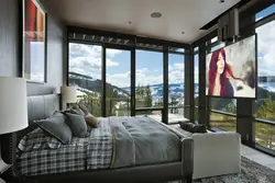 Bedroom design with panoramic windows in an apartment