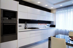 Design of a straight kitchen in a modern style with a refrigerator