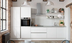Design of a straight kitchen in a modern style with a refrigerator