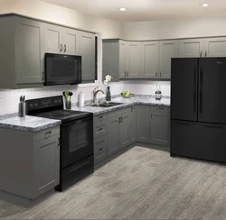 Kitchens with dark refrigerator photo