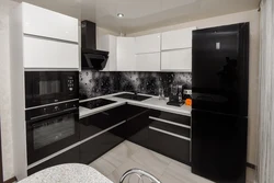 Kitchens with dark refrigerator photo