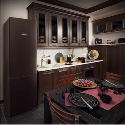 Kitchens with dark refrigerator photo