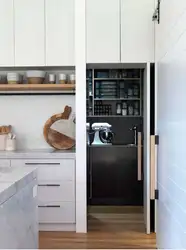 Narrow cabinets in the kitchen interior