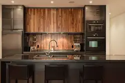 Photos of kitchens with dark panels