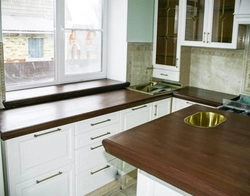 Kitchens with a window if the window is below the countertop photo
