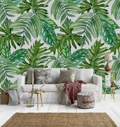 Wallpaper with palm leaves in the bedroom interior