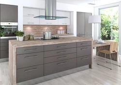 Photo of a gray kitchen combined with wood