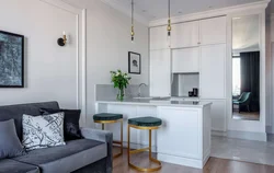 White kitchen with gray sofa photo
