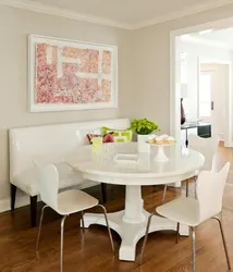 Photo of a round table for the kitchen against the wall