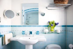 What color goes with blue in the bathroom interior