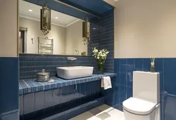 What color goes with blue in the bathroom interior