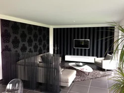 If the living room has black and white wallpaper photo