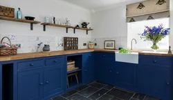 Blue kitchen in the interior photo with wooden