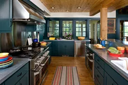 Blue kitchen in the interior photo with wooden