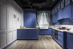 Blue kitchen in the interior photo with wooden