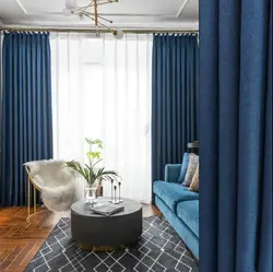 Gray living room with blue curtains photo