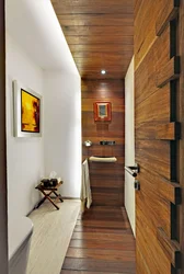 Hallway design in an apartment with laminate flooring on the wall