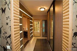 Hallway design in an apartment with laminate flooring on the wall