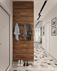 Hallway design in an apartment with laminate flooring on the wall