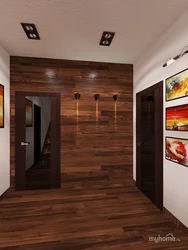 Hallway design in an apartment with laminate flooring on the wall