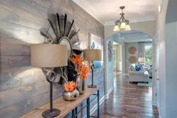 Hallway design in an apartment with laminate flooring on the wall