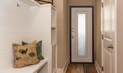 Hallway with front door with mirror photo