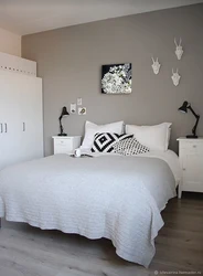 Bedroom wall design with white furniture