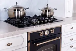 Black Gas Stove In The Kitchen Interior