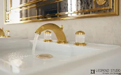 Gold faucets in the bathroom interior