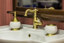 Gold Faucets In The Bathroom Interior