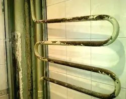 Heating radiator in the bathroom photo