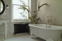 Heating radiator in the bathroom photo