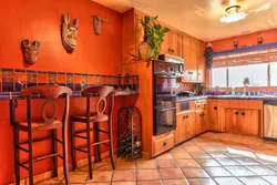 Terracotta color kitchen photo in the interior