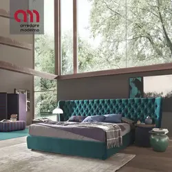 Turquoise Bed In A Bedroom Interior With A Soft Headboard