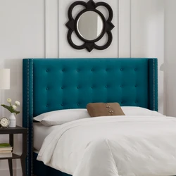 Turquoise Bed In A Bedroom Interior With A Soft Headboard