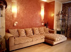 Sconce above the sofa in the living room in the interior