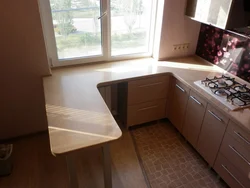 Window sill as a countertop in the kitchen photo in Khrushchev