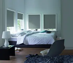Roller blinds in the bedroom in the interior photo
